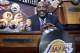 Basketball Hall of Famer James Worthy smiles before the start of the NBA basketbal draft lottery in New York, Tuesday, May 20, 2014. Worthy brought bobble-head dolls of the late Lakers broadcaster Chick Hearn and the late Lakers owner Jerry Buss with him for good luck. (AP Photo/Kathy Willens)
