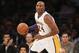 Los Angeles Lakers' Kobe Bryant dribbles the ball against the Toronto Raptors during the first half of an NBA basketball game in Los Angeles, Sunday, Dec. 8, 2013. It was Bryant's first game back after a torn left Achilles tendon injury on April 12th and the Raptors won 106-94. (AP Photo/Danny Moloshok)