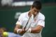 Novak Djokovic of Serbia plays a return to Andrey Golubev of Kazakhstan during their first round match at the All England Lawn Tennis Championships in Wimbledon, London, Monday, June 23, 2014. (AP Photo/Pavel Golovkin)