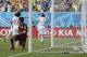 Italy's goalkeeper Gianluigi Buffon kneels outside his goal after being scored on by Uruguay's Diego Godin (3) during the group D World Cup soccer match between Italy and Uruguay at the Arena das Dunas in Natal, Brazil, Tuesday, June 24, 2014. Uruguary defeated Italy 1-0. (AP Photo/Ricardo Mazalan)