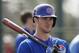 FILE - In this Feb. 21, 2014 file photo, Chicago Cubs third baseman Kris Bryant prepares to take batting practice during spring training baseball practice in Mesa, Ariz. Bryant, 22, is a big-time prospect. (AP Photo/Rick Scuteri, File)