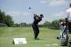 Tiger Woods gets set to swing at the driving range as he practices at the Quicken Loans National golf tournament, Tuesday, June 24, 2014, in Bethesda, Md. (AP Photo/Nick Wass)