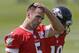 Baltimore Ravens quarterback Joe Flacco pauses during NFL football practice, Tuesday, June 17, 2014, at the team's practice facility in Owings Mills, Md. (AP Photo/Patrick Semansky)