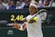 Rafael Nadal of Spain plays a return to Martin Klizan of Slovakia during their match at the All England Lawn Tennis Championships in Wimbledon, London, Tuesday, June 24, 2014. (AP Photo/Sang Tan)