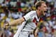 Germany's Benedikt Hoewedes celebrates after his teammate Miroslav Klose scored a goal during the group G World Cup soccer match between Germany and Ghana at the Arena Castelao in Fortaleza, Brazil, Saturday, June 21, 2014. (AP Photo/Matthias Schrader)