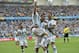 Argentina's Lionel Messi, left, is carried by his teammates Argentina's Angel di Maria (7) and Argentina's Marcos Rojo after scoring his side's first goal during the group F World Cup soccer match between Nigeria and Argentina at the Estadio Beira-Rio in Porto Alegre, Brazil, Wednesday, June 25, 2014. (AP Photo/Martin Meissner)