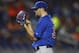 Chicago Cubs starter Jason Hammel studies a Miami Marlins batter after giving a two-run home run during the first inning of a baseball game in Miami, Monday, June 16, 2014. (AP Photo/J Pat Carter)