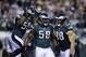 Philadelphia Eagles' Trent Cole (58), DeMeco Ryans (59) and Connor Barwin (98) is seen during an NFL football game against the Chicago Bears, Sunday, Dec. 22, 2013, in Philadelphia. (AP Photo/Michael Perez)
