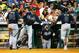 HOUSTON, TX - JUNE 25: Ryan Doumit (C) #4 of the Atlanta Braves greets Evan Gattis #24 and Justin Upton #8 after Upton hit a sacrifice fly to score Gattis in the second inning of their game against the Houston Astros at Minute Maid Park on June 25, 2014 in Houston, Texas. (Photo by Scott Halleran/Getty Images)