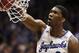 Kansas center Joel Embiid dunks during the first half of an NCAA college basketball game against Texas in Lawrence, Kan., Saturday, Feb. 22, 2014. (AP Photo/Orlin Wagner)