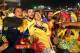 Colombia soccer fans celebrate the second goal scored by their team as they watch a live telecast of their team's World Cup against with Japan inside the FIFA Fan Fest area on Copacabana beach, in Rio de Janeiro, Brazil, Tuesday, June 24, 2014. Substitute James Rodriguez scored a brilliant goal and set up two more for Jackson Martinez as Colombia beat Japan 4-1 on Tuesday to confirm top spot in Group C and eliminate the Asian champions from the World Cup. (AP Photo/Leo Correa)