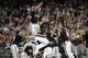 Vanderbilt players celebrate after Vanderbilt defeated Virginia 3-2 in the deciding game of the best-of-three NCAA baseball College World Series finals in Omaha, Neb., Wednesday, June 25, 2014. (AP Photo/Eric Francis)