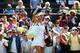 LONDON, ENGLAND - JUNE 24: Maria Sharapova of Russia waves to the fans after winning her Ladies' Singles first round match against against Samantha Murray of Great Britain on day two of the Wimbledon Lawn Tennis Championships at the All England Lawn Tennis and Croquet Club at Wimbledon on June 24, 2014 in London, England. (Photo by Jan Kruger/Getty Images)