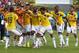 CUIABA, BRAZIL - JUNE 24: Juan Guillermo Cuadrado of Colombia celebrates with teammates scoring his team's first goal after a penalty kick during the 2014 FIFA World Cup Brazil Group C match between Japan and Colombia at Arena Pantanal on June 24, 2014 in Cuiaba, Brazil. (Photo by Mark Kolbe/Getty Images)
