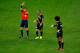 SAO PAULO, BRAZIL - JUNE 26: Steven Defour and Marouane Fellaini of Belgium protest to referee Benjamin Williams as he shows a red card to Defour during the 2014 FIFA World Cup Brazil Group H match between South Korea and Belgium at Arena de Sao Paulo on June 26, 2014 in Sao Paulo, Brazil. (Photo by Matthew Lewis/Getty Images)