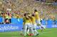 Brazil celebrate after Brazil's Neymar's first goal during the group A World Cup soccer match between Cameroon and Brazil at the Estadio Nacional in Brasilia, Brazil, Monday, June 23, 2014. (AP Photo/Bernat Armangue)