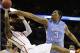 Iowa State guard DeAndre Kane (50) tries to shoot as North Carolina forward Kennedy Meeks (3) defends during the second half of a third-round game in the NCAA college basketball tournament Sunday, March 23, 2014, in San Antonio. (AP Photo/David J. Phillip)