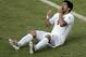Uruguay's Luis Suarez (9) holds his teeth after running into Italy's Giorgio Chiellini's shoulder during the group D World Cup soccer match between Italy and Uruguay at the Arena das Dunas in Natal, Brazil, Tuesday, June 24, 2014. (AP Photo/Hassan Ammar)