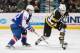 WINDSOR, ON - JANUARY 30: Roland McKeown #20 of the Kingston Frontenacs drives past Sam Povorozniouk #22 of the Windsor Spitfires on January 30, 2014 at the WFCU Centre in Windsor, Ontario, Canada. (Photo by Dennis Pajot/Getty Images)
