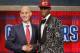 NBA Commissioner Adam Silver, left, congratulates Andrew Wiggins of Kansas who was selected by the Cleveland Cavaliers as the number one pick in the 2014 NBA draft, Thursday, June 26, 2014, in New York. (AP Photo/Jason DeCrow)