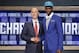 Indiana's Noah Vonleh, right, poses for a photo with NBA Commissioner Adam Silver after being selected ninth overall by the Charlotte Hornets during the 2014 NBA draft, Thursday, June 26, 2014, in New York. (AP Photo/Jason DeCrow)