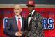 NBA Commissioner Adam Silver, left, congratulates Andrew Wiggins of Kansas who was selected by the Cleveland Cavaliers as the number one pick in the 2014 NBA draft, Thursday, June 26, 2014, in New York. (AP Photo/Jason DeCrow)
