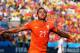 SAO PAULO, BRAZIL - JUNE 23: Memphis Depay of the Netherlands celebrates scoring his team's second goal during the 2014 FIFA World Cup Brazil Group B match between the Netherlands and Chile at Arena de Sao Paulo on June 23, 2014 in Sao Paulo, Brazil. (Photo by Dean Mouhtaropoulos/Getty Images)