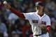Boston Red Sox's Brock Holt throws to first base on a ground out by Baltimore Orioles' Nelson Cruz in the eighth inning of a baseball game in Boston, Saturday, April 19, 2014. (AP Photo/Michael Dwyer)