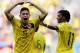Colombia's James Rodriguez (10) celebrates with teammate Colombia's Juan Cuadrado after scoring his side's first goal during the group C World Cup soccer match between Colombia and Ivory Coast at the Estadio Nacional in Brasilia, Brazil, Thursday, June 19, 2014. (AP Photo/Fernando Llano)