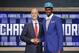 Indiana's Noah Vonleh, right, poses for a photo with NBA Commissioner Adam Silver after being selected ninth overall by the Charlotte Hornets during the 2014 NBA draft, Thursday, June 26, 2014, in New York. (AP Photo/Jason DeCrow)