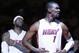 Miami Heat center Chris Bosh (1) and forward LeBron James are shown during team introductions before the start of Game 2 of an Eastern Conference semifinal basketball game between the Miami Heat and the Brooklyn Nets, Thursday, May 8, 2014 in Miami. (AP Photo/Wilfredo Lee)