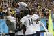 French players celebrate after France's Karim Benzema, left, scored his side's fourth goal during the group E World Cup soccer match between Switzerland and France at the Arena Fonte Nova in Salvador, Brazil, Friday, June 20, 2014. (AP Photo/Christophe Ena)