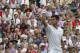 Novak Djokovic of Serbia celebrates winning against Gilles Simon of France during the men's singles match at the All England Lawn Tennis Championships in Wimbledon, London, Friday, June 27, 2014. (AP Photo/Sang Tan)
