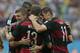 Germany's Miroslav Klose, right, congratulates Thomas Mueller after he scored the opening goal during the group G World Cup soccer match between the USA and Germany at the Arena Pernambuco in Recife, Brazil, Thursday, June 26, 2014. (AP Photo/Petr David Josek)