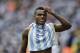 Nigeria's Emmanuel Emenike walks off the pitch with an Argentina jersey during the group F World Cup soccer match between Nigeria and Argentina at the Estadio Beira-Rio in Porto Alegre, Brazil, Wednesday, June 25, 2014. (AP Photo/Martin Meissner)
