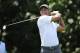 Tiger Woods watches his tee shot on the sixth hole during the second round of the Quicken Loans National golf tournament, Friday, June 27, 2014, in Bethesda, Md. (AP Photo/Nick Wass)