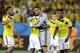 Colombia's goalkeeper Faryd Mondragon, center, is embraced by his teammates after the group C World Cup soccer match between Japan and Colombia at the Arena Pantanal in Cuiaba, Brazil, Tuesday, June 24, 2014. Colombia won the match 4-1. (AP Photo/Kirsty Wigglesworth)