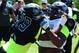 Jul 3, 2013; Beaverton, OR, USA; Defensive lineman Andrew Williams (79) battles offensive lineman Roderick Taylor (72) during the Lineman Challenge session of the 'The Opening' at Nike World Headquarters. Mandatory Credit: Steve Dykes-USA TODAY Sports