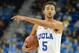Jan 23, 2014; Los Angeles, CA, USA; UCLA Bruins guard/forward Kyle Anderson (5) directs the offense in the second half against the Stanford Cardinal at Pauley Pavilion. UCLA won 91-74. Mandatory Credit: Jayne Kamin-Oncea-USA TODAY Sports