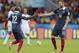 France's Karim Benzema, right, celebrates with France's Rio Mavuba after scoring his side's third goal during the group E World Cup soccer match between France and Honduras at the Estadio Beira-Rio in Porto Alegre, Brazil, Sunday, June 15, 2014. (AP Photo/David Vincent)