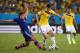 CUIABA, BRAZIL - JUNE 24: Toshihiro Aoyama of Japan tackles James Rodriguez of Colombia during the 2014 FIFA World Cup Brazil Group C match between Japan and Colombia at Arena Pantanal on June 24, 2014 in Cuiaba, Brazil. (Photo by Adam Pretty/Getty Images)