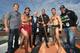 AUCKLAND, NEW ZEALAND - JUNE 24: UFC Fighters Jared Rosholt of USA (L) James Te Huna (C) and Soa Palelei of Australia (R) join Maori cultural performers Edz Eramiha (R) and Iwi Matthews (L) with UFC Managing Director Tom Wright (in suit) after a traditional maori welcome for UFC fighters at Te Wero Bridge on June 24, 2014 in Auckland, New Zealand. Fighters were welcomed to Auckland ahead of the UFC fight night on June 28 at Vector Arena. (Photo by Fiona Goodall/Getty Images)