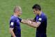 Netherlands' Robin van Persie, right, gives the captain's arm band to his teammate Arjen Robben before he is substituted during the group B World Cup soccer match between Australia and the Netherlands at the Estadio Beira-Rio in Porto Alegre, Brazil, Wednesday, June 18, 2014. (AP Photo/Michael Sohn)