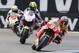 Marc Marquez of Spain, right, competes on his Honda with Karel Abraham of Czech Republic on his Honda, centre, and Andrea Iannone of Italy on his Ducati, left, during qualifying for the Dutch MotoGP Grand Prix, in Assen, northern Netherlands, Friday June 27, 2014. (AP Photo/Vincent Jannink)