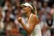 LONDON, ENGLAND - JUNE 28: Maria Sharapova of Russia celebrates during her Ladies' Singles third round match against Alison Riske of the United States on day six of the Wimbledon Lawn Tennis Championships at the All England Lawn Tennis and Croquet Club at Wimbledon on June 28, 2014 in London, England. (Photo by Matthew Stockman/Getty Images)