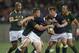 South Africa's Handre Pollard centre left, tackles Nick De Luca of Scotland, during their Rugby test match in Port Elizabeth, South Africa, Saturday, June 28, 2014. (AP Photo)