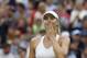 Maria Sharapova of Russia celebrates defeating Alison Riske of U.S. in their women's singles match at the All England Lawn Tennis Championships in Wimbledon, London, Saturday, June 28, 2014. (AP Photo/Ben Curtis)