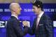Nik Stauskas, right, is greeted by NBA Commissioner Adam Silver after being selected eighth overall by the Sacramento Kings during the 2014 NBA draft, Thursday, June 26, 2014, in New York. (AP Photo/Kathy Willens)