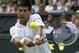 Novak Djokovic of Serbia plays a return against Gilles Simon of France during the men's singles match at the All England Lawn Tennis Championships in Wimbledon, London, Friday, June 27, 2014. (AP Photo/Sang Tan)