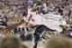 Florida center Patric Young (4) goes after a loose ball against Connecticut during the second half of the NCAA Final Four tournament college basketball semifinal game Saturday, April 5, 2014, in Arlington, Texas. Connecticut won 63-53. (AP Photo/Charlie Neibergall)